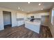 Modern kitchen with a large island, stainless steel appliances, and ample cabinet space at 490 Grey Rock St, Brighton, CO 80601