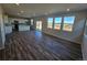 This home features an open floor plan with lots of natural light and modern wood flooring at 490 Grey Rock St, Brighton, CO 80601