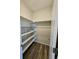 Spacious walk-in closet with ample shelving for organized storage at 490 Grey Rock St, Brighton, CO 80601