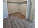 Walk-in closet features neutral walls, carpet floors, and a metal rack at 490 Grey Rock St, Brighton, CO 80601