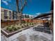 Landscaped backyard featuring modern patio furniture, perfect for outdoor relaxation and entertainment at 1260 Newton St # 1, Denver, CO 80204