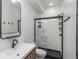 Bathroom with a modern vanity and a glass-enclosed shower at 1260 Newton St # 1, Denver, CO 80204