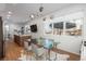 Bright dining area with modern chandelier, glass table, and views to the beautiful backyard at 1260 Newton St # 1, Denver, CO 80204