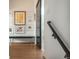 Hallway with artwork, a bench, and hardwood floors at 1260 Newton St # 1, Denver, CO 80204