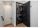 Modern laundry room with a stacked washer and dryer at 1260 Newton St # 1, Denver, CO 80204