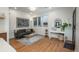 Inviting living room with hardwood floors, a comfortable couch, and stylish decor at 1260 Newton St # 1, Denver, CO 80204