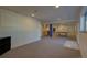 Large open finished basement offering versatile space with a bar and recreation area at 19563 E Ithaca Pl, Aurora, CO 80013