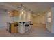 Basement bar area perfect for entertaining, complete with a sink, cabinets, and bar seating at 19563 E Ithaca Pl, Aurora, CO 80013