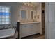 Bathroom boasting double sinks, stylish mirrors and tub with modern fixtures at 19563 E Ithaca Pl, Aurora, CO 80013