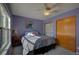 Bedroom featuring a ceiling fan, window, double bed and closet at 19563 E Ithaca Pl, Aurora, CO 80013