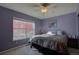 Bedroom featuring a ceiling fan, double bed and closet at 19563 E Ithaca Pl, Aurora, CO 80013