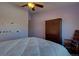 Relaxing bedroom with a ceiling fan, classic furniture, and a soft, inviting bed at 19563 E Ithaca Pl, Aurora, CO 80013