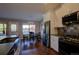 Kitchen and dining area, with stainless steel appliances and eat-in dining area at 19563 E Ithaca Pl, Aurora, CO 80013