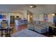 Bright open-concept living room and kitchen space, with hardwood flooring and modern decor at 19563 E Ithaca Pl, Aurora, CO 80013