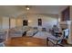 Cozy living room with hardwood floors, a fireplace, and seating area at 19563 E Ithaca Pl, Aurora, CO 80013