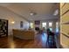 Open concept living room with a vaulted ceiling, fireplace, and bar-height seating in the kitchen at 19563 E Ithaca Pl, Aurora, CO 80013