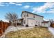 Spacious fenced backyard with a patio, hot tub, and a storage shed, perfect for outdoor living at 5819 W 82Nd Cir, Arvada, CO 80003