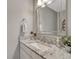 Elegant bathroom featuring granite countertops, a modern sink, and a stylish mirror, creating a spa-like experience at 5819 W 82Nd Cir, Arvada, CO 80003