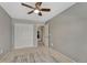 Bedroom with carpeted floors, ceiling fan and closet with bi-fold doors at 5819 W 82Nd Cir, Arvada, CO 80003