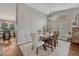 Elegant dining room with hardwood floors and stylish chandelier, perfect for entertaining guests at 5819 W 82Nd Cir, Arvada, CO 80003