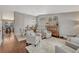 Inviting living room featuring hardwood floors, neutral paint, and elegant furnishings creating a comfortable ambiance at 5819 W 82Nd Cir, Arvada, CO 80003