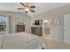 Spacious main bedroom with a ceiling fan, ensuite bath, and large windows, creating a relaxing retreat at 5819 W 82Nd Cir, Arvada, CO 80003