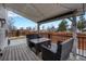 Relaxing covered patio with outdoor seating and string lights overlooking the backyard at 5819 W 82Nd Cir, Arvada, CO 80003