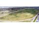 The aerial view highlights the vast green space with walking paths in the surrounding neighborhood at 7777 E 23Rd Ave # 1406, Denver, CO 80238