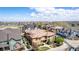 An aerial image displaying a tan residence surrounded by well-manicured lawns, lush trees and blue residences at 7777 E 23Rd Ave # 1406, Denver, CO 80238