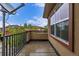 The balcony has iron railings and provides stunning views of nearby homes and lush greenery at 7777 E 23Rd Ave # 1406, Denver, CO 80238
