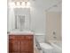 Bright bathroom featuring a vanity with white countertop, wood cabinets, and a shower-tub combination at 7777 E 23Rd Ave # 1406, Denver, CO 80238