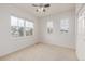 Bedroom features neutral walls, carpet flooring, ceiling fan and bright windows for natural light at 7777 E 23Rd Ave # 1406, Denver, CO 80238