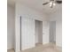 Bedroom features closet with sliding doors allowing easy access to storage space for clothing and accessories at 7777 E 23Rd Ave # 1406, Denver, CO 80238