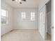 Bedroom featuring neutral walls, carpet flooring, ceiling fan and bright windows for natural light at 7777 E 23Rd Ave # 1406, Denver, CO 80238