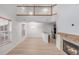 Well-lit living space featuring a fireplace, dining area, and an open view of the kitchen at 7777 E 23Rd Ave # 1406, Denver, CO 80238