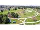 Gorgeous areal view of the community park, which has open space, walking paths, and mature trees at 7777 E 23Rd Ave # 1406, Denver, CO 80238