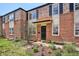 Traditional brick home boasts colorful landscaping and charming black shutters at 1165 Krameria St, Denver, CO 80220