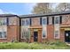 Traditional brick home boasts colorful landscaping and black shutters at 1165 Krameria St, Denver, CO 80220