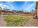 Spacious backyard with multi-level terraced hill and wooden fence at 5162 Hubert St, Parker, CO 80134
