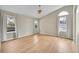 Bedroom with vaulted ceiling, neutral paint, light-colored hardwood floors and ample natural light at 5162 Hubert St, Parker, CO 80134
