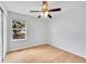 Bright bedroom featuring a ceiling fan and light-colored wood floors and ample natural light at 5162 Hubert St, Parker, CO 80134