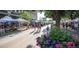 Vibrant outdoor market with tents, vendors, and people enjoying a community event on a sunny day at 5162 Hubert St, Parker, CO 80134