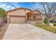 Charming two-story home with a two-car garage, front porch and well-maintained lawn at 5162 Hubert St, Parker, CO 80134