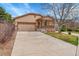 Charming single-Gathering home with a two-car garage, covered porch, and well-manicured lawn at 5162 Hubert St, Parker, CO 80134