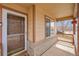 Close up front porch view, showing door, window, and railing at 5162 Hubert St, Parker, CO 80134