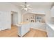 Bright kitchen featuring a movable island and an archway through to the living room at 5162 Hubert St, Parker, CO 80134
