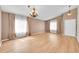 Living room featuring hardwood floors, natural light, a chandelier and neutral walls at 5162 Hubert St, Parker, CO 80134