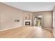 Bright living room with wood floors, fireplace, and sliding glass doors to outdoor space at 5162 Hubert St, Parker, CO 80134