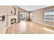 Living room with hardwood floors, fireplace and sliding glass doors to outdoor patio at 5162 Hubert St, Parker, CO 80134