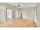 Spacious main bedroom with ensuite bathroom, hardwood floors and a ceiling fan at 5162 Hubert St, Parker, CO 80134